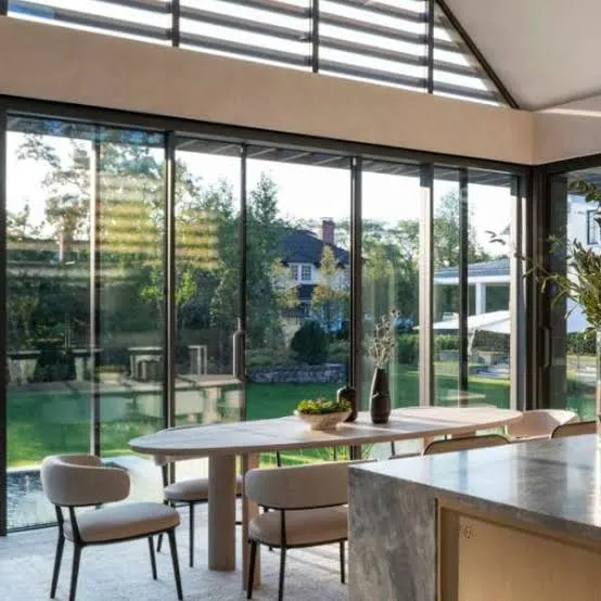 Floor-to-ceiling European sliding doors opening a Toronto dining room to the garden