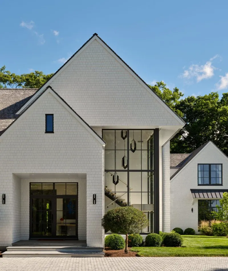 Modern Toronto home with black-framed European aluminum windows and glazed entry