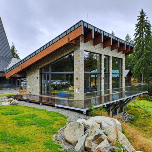 Cottage with custom-installed energy-efficient windows in a natural wood frame.