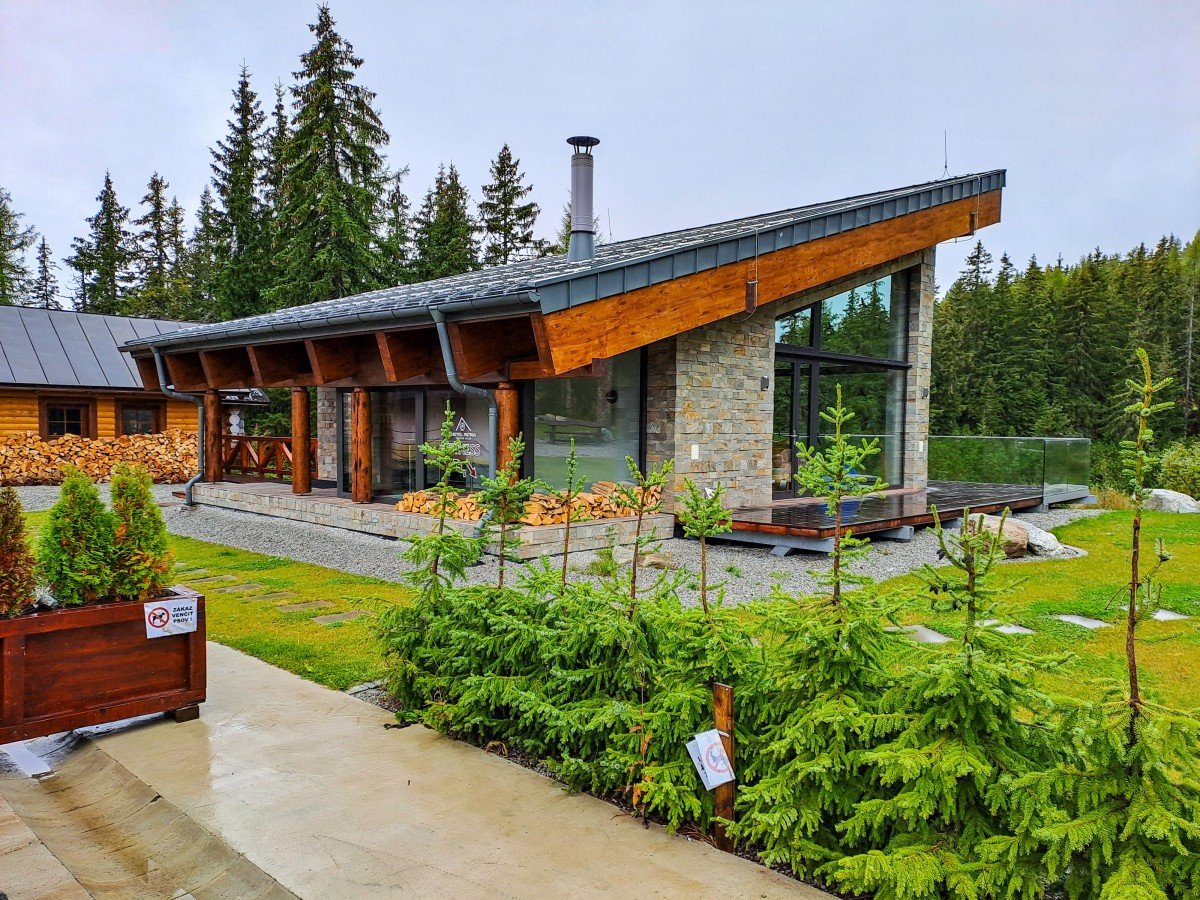 Charming cottage with professionally installed wood-framed windows, designed for natural light, insulation, and rustic style.